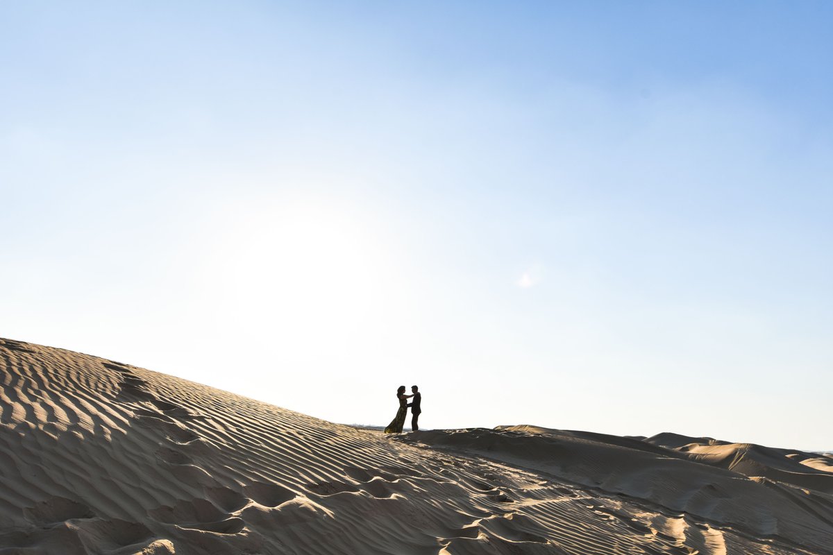 Couple on the desert dunes near Dubai